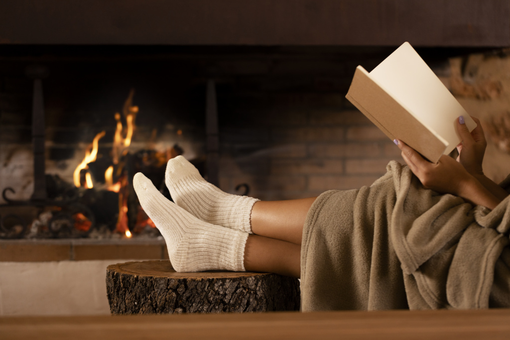 close-up-hands-holding-book-by-fire.jpg